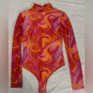 Orange and pink graphic design long sleeve bodysuit